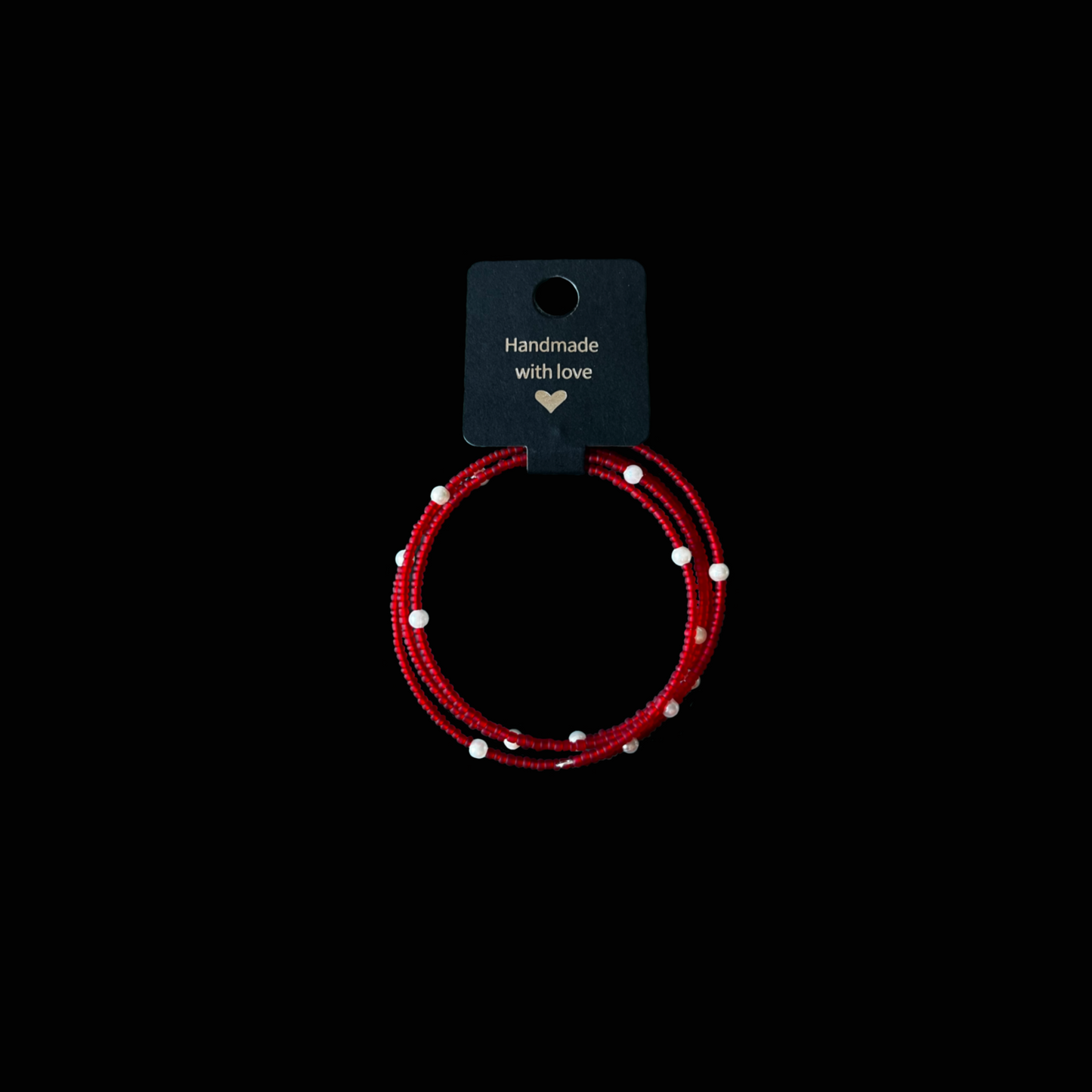 Passion – handgjort armband i rött och vitt från kollektionen Viva. Unikt exemplar som utstrålar glädje, värme och självsäkerhet.